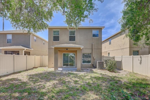 10524 White Peacock Pl, Riverview, FL 33578 - back of property with stucco siding, cooling unit, and a fenced backyard