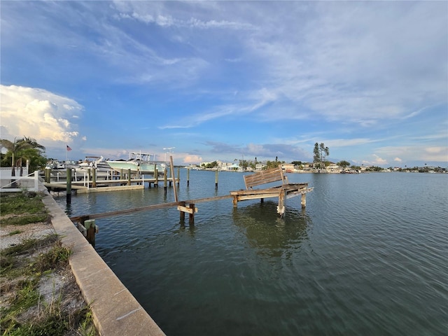 249 144th Ave, Madeira Beach, FL 33708 - dock area with a water view and boat lift