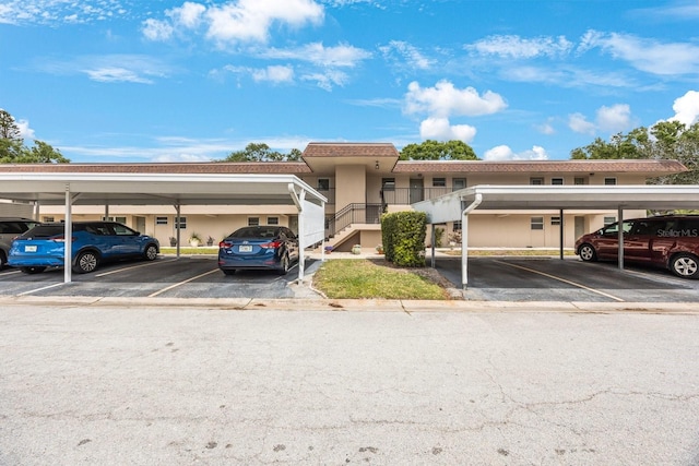 9945 47th Ave N Unit 203, Saint Petersburg, FL 33708 - multi unit property featuring covered parking and stucco siding