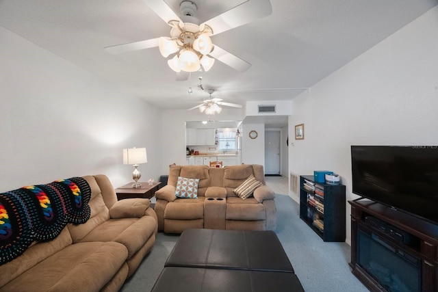9945 47th Ave N Unit 203, Saint Petersburg, FL 33708 - living area featuring carpet floors, visible vents, and a ceiling fan