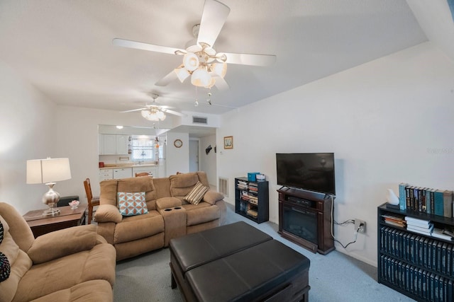 9945 47th Ave N Unit 203, Saint Petersburg, FL 33708 - living area with carpet floors, ceiling fan, and visible vents