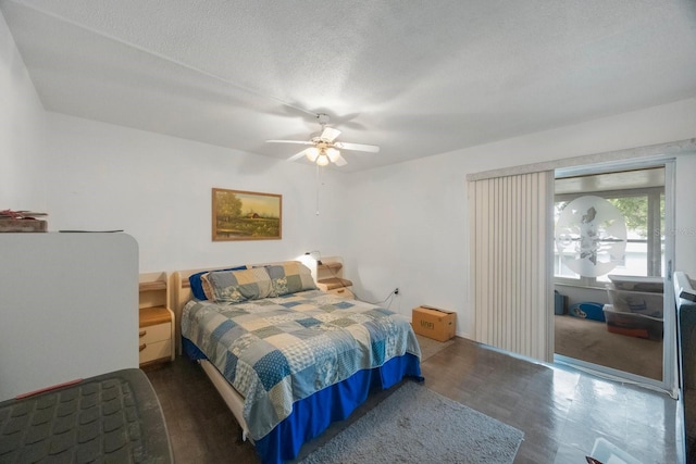 9945 47th Ave N Unit 203, Saint Petersburg, FL 33708 - bedroom featuring a textured ceiling and a ceiling fan