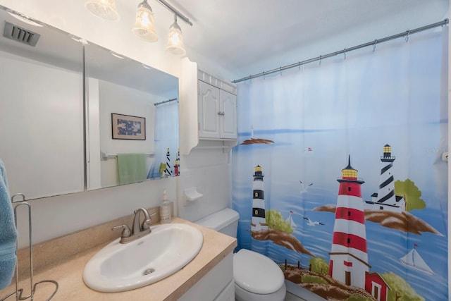 9945 47th Ave N Unit 203, Saint Petersburg, FL 33708 - bathroom with toilet, vanity, and visible vents