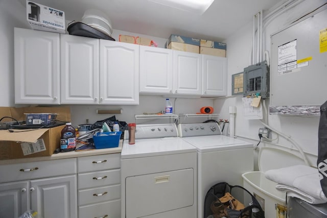 9945 47th Ave N Unit 203, Saint Petersburg, FL 33708 - laundry room featuring cabinet space and washer and clothes dryer