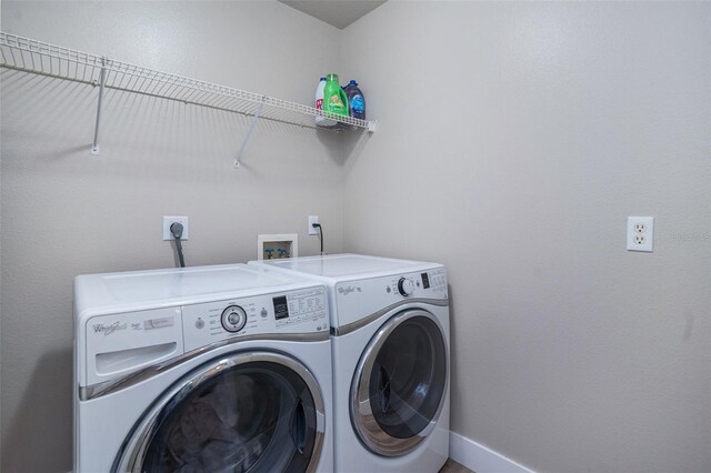 1601 14th St W, Palmetto, FL 34221 - laundry area with washer and clothes dryer and baseboards