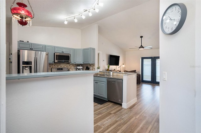 1601 14th St W, Palmetto, FL 34221 - kitchen with appliances with stainless steel finishes, high vaulted ceiling, french doors, gray cabinets, and a sink