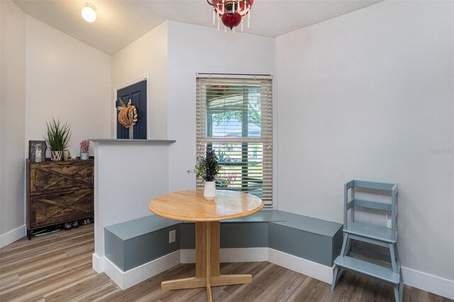 1601 14th St W, Palmetto, FL 34221 - dining space with wood finished floors, baseboards, and vaulted ceiling