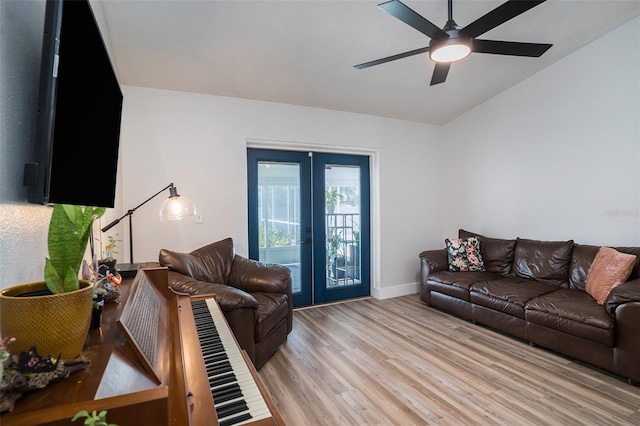 1601 14th St W, Palmetto, FL 34221 - living area with french doors, light wood finished floors, a ceiling fan, and baseboards
