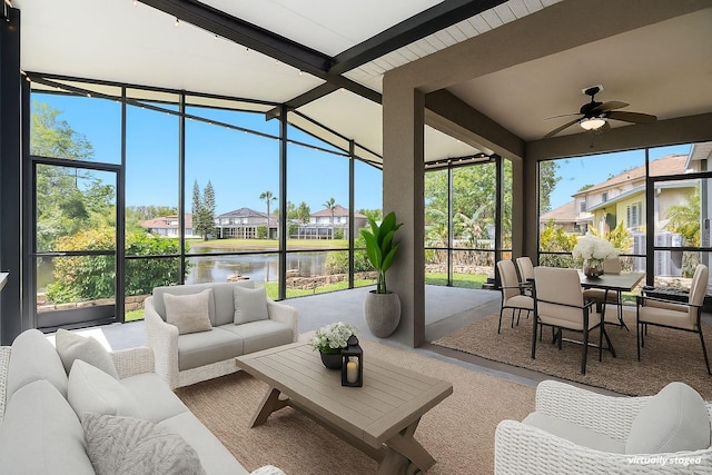 3219 Gianna Way, Land O Lakes, FL 34638 - sunroom / solarium with an outdoor hangout area, a water view, a ceiling fan, expansive windows, and healthy amount of natural light
