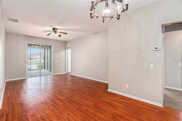 3219 Gianna Way, Land O Lakes, FL 34638 - empty room with ceiling fan, wood finished floors, and a chandelier