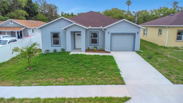 8505 N Brooks St, Tampa, FL 33604 - ranch-style house featuring driveway, an attached garage, stucco siding, and roof with shingles