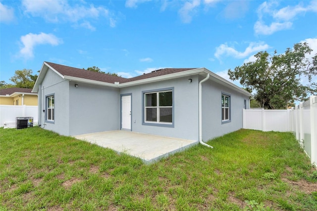 8505 N Brooks St, Tampa, FL 33604 - rear view of property with stucco siding and a patio