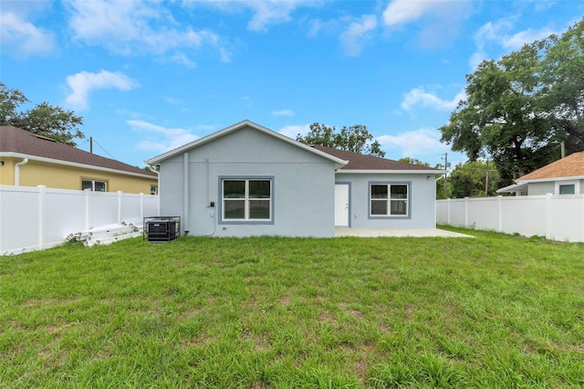 8505 N Brooks St, Tampa, FL 33604 - rear view of property featuring cooling unit, stucco siding, and a patio