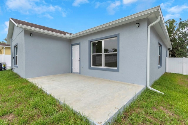 8505 N Brooks St, Tampa, FL 33604 - rear view of property featuring a patio, stucco siding, and cooling unit