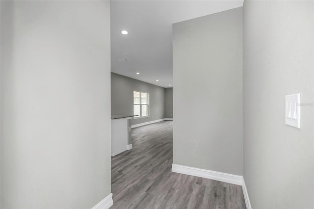 8505 N Brooks St, Tampa, FL 33604 - corridor featuring baseboards, recessed lighting, and wood finished floors