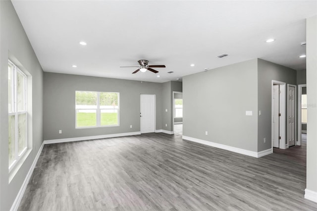8505 N Brooks St, Tampa, FL 33604 - unfurnished living room featuring wood finished floors, baseboards, recessed lighting, and a ceiling fan