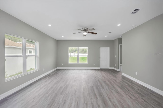 8505 N Brooks St, Tampa, FL 33604 - unfurnished room with ceiling fan, wood finished floors, baseboards, and recessed lighting