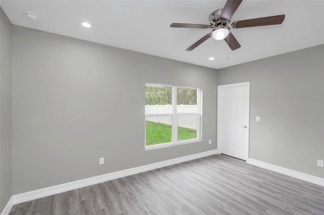 8505 N Brooks St, Tampa, FL 33604 - empty room featuring baseboards, wood finished floors, ceiling fan, a smoke detector, and recessed lighting