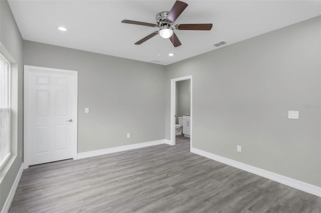 8505 N Brooks St, Tampa, FL 33604 - unfurnished room with baseboards, a ceiling fan, wood finished floors, and recessed lighting