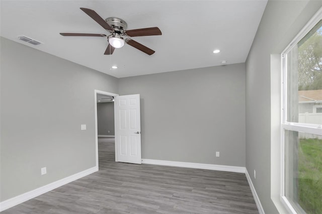 8505 N Brooks St, Tampa, FL 33604 - unfurnished room with ceiling fan, baseboards, wood finished floors, and recessed lighting