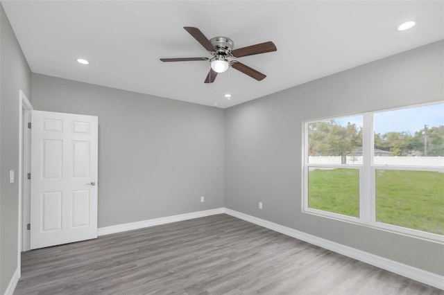 8505 N Brooks St, Tampa, FL 33604 - unfurnished room featuring baseboards, a ceiling fan, wood finished floors, and recessed lighting