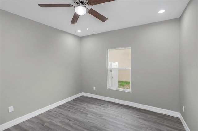 8505 N Brooks St, Tampa, FL 33604 - spare room with baseboards, dark wood-type flooring, a ceiling fan, and recessed lighting