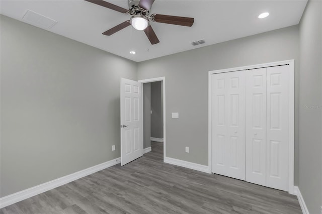 8505 N Brooks St, Tampa, FL 33604 - unfurnished bedroom featuring wood finished floors, baseboards, recessed lighting, a closet, and a ceiling fan