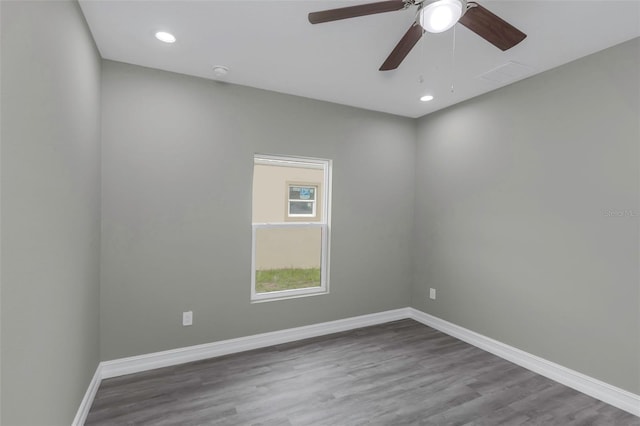 8505 N Brooks St, Tampa, FL 33604 - unfurnished room with baseboards, wood finished floors, ceiling fan, recessed lighting, and a smoke detector