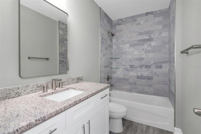 8505 N Brooks St, Tampa, FL 33604 - full bathroom with vanity, toilet, wood finished floors, and bathing tub / shower combination