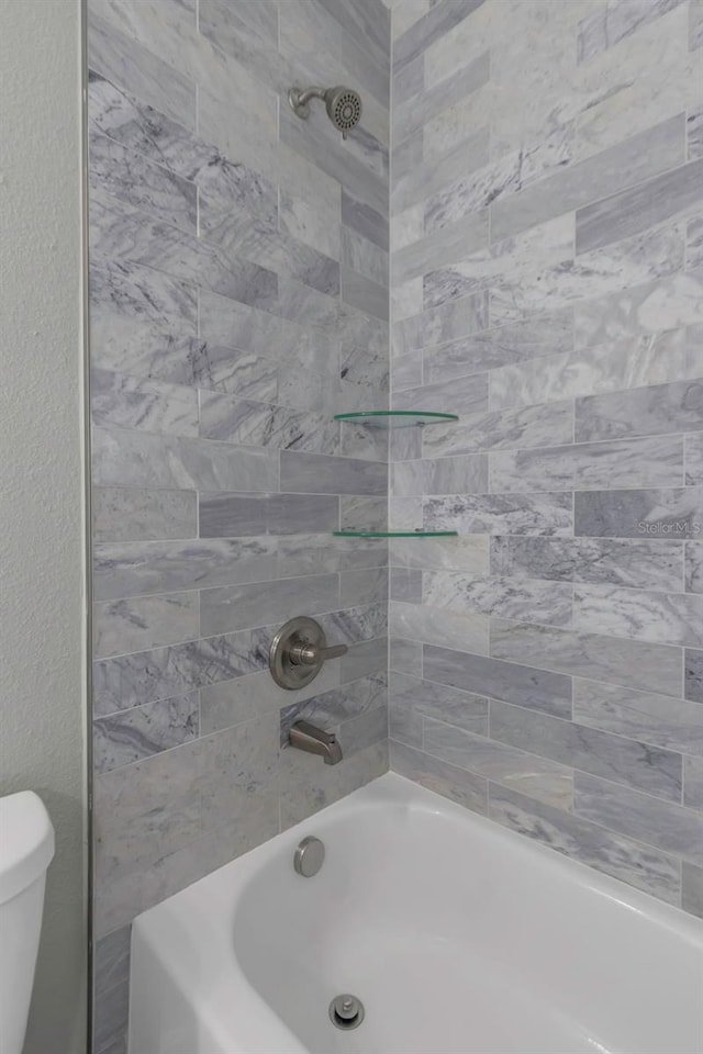 8505 N Brooks St, Tampa, FL 33604 - full bathroom featuring toilet and bathing tub / shower combination