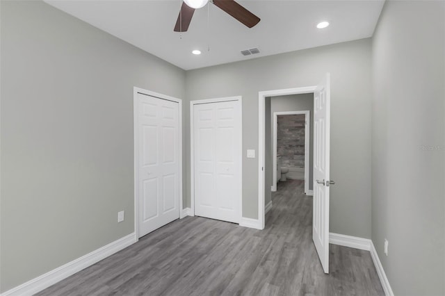 8505 N Brooks St, Tampa, FL 33604 - unfurnished bedroom featuring wood finished floors, baseboards, ceiling fan, recessed lighting, and a closet