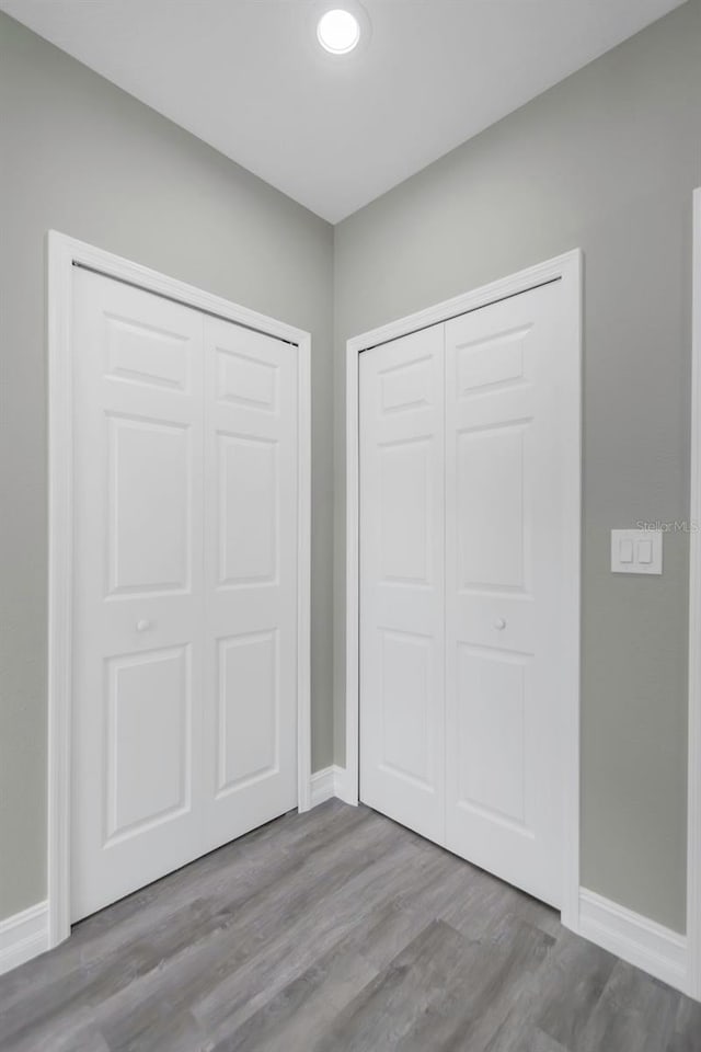 8505 N Brooks St, Tampa, FL 33604 - unfurnished bedroom with baseboards, wood finished floors, and a closet
