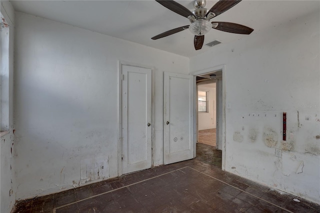 unfurnished bedroom with visible vents and ceiling fan