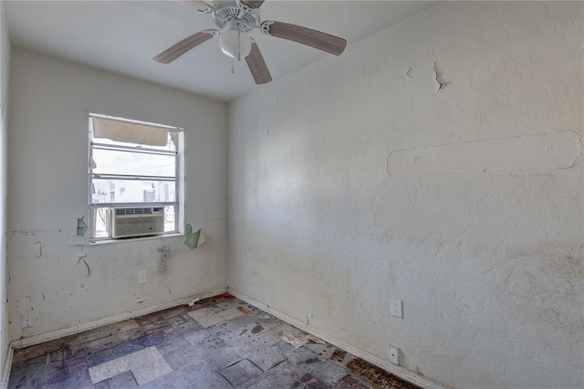 unfurnished room featuring ceiling fan, baseboards, and cooling unit