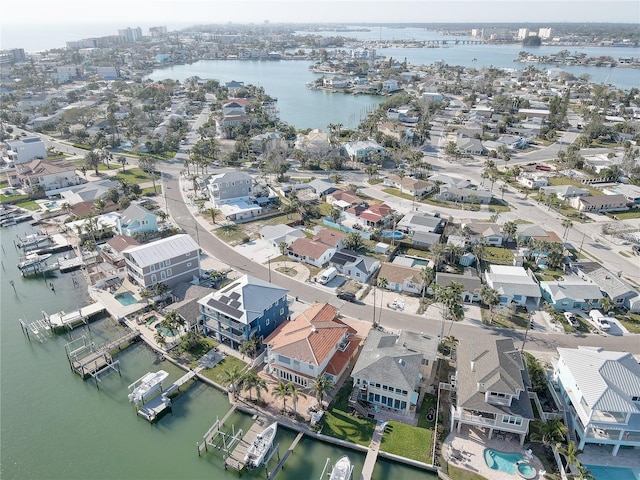 bird's eye view featuring a water view and a residential view