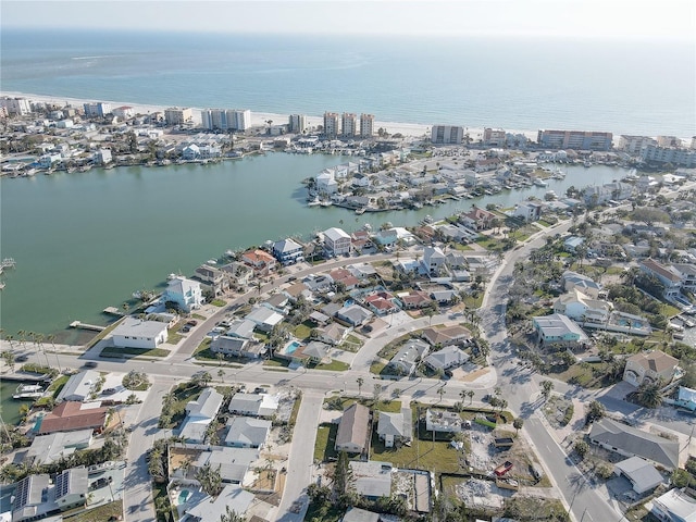 drone / aerial view featuring a city view, a residential view, and a water view