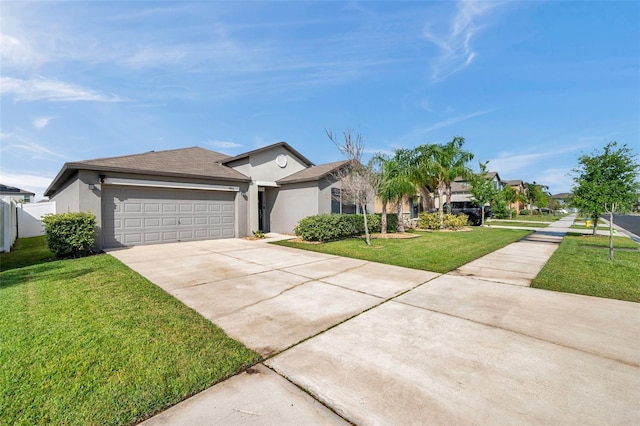 4201 Globe Thistle Dr, Tampa, FL 33619 - single story home featuring stucco siding, a garage, a front lawn, and concrete driveway