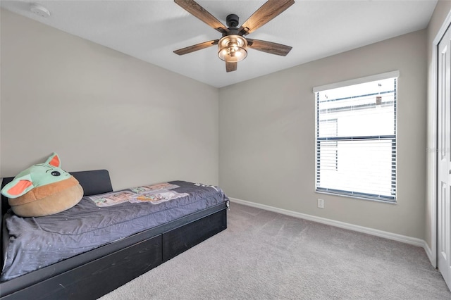 4201 Globe Thistle Dr, Tampa, FL 33619 - carpeted bedroom with baseboards and ceiling fan