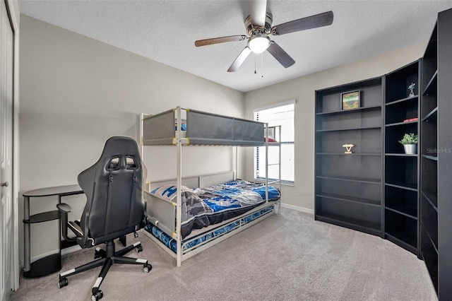 4201 Globe Thistle Dr, Tampa, FL 33619 - carpeted bedroom featuring a textured ceiling, baseboards, and ceiling fan