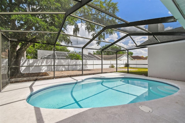 view of pool with a fenced in pool, a fenced backyard, a lanai, and a patio area