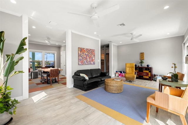 living area with visible vents, crown molding, baseboards, recessed lighting, and a ceiling fan