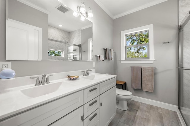 bathroom with a stall shower, visible vents, ornamental molding, and a sink