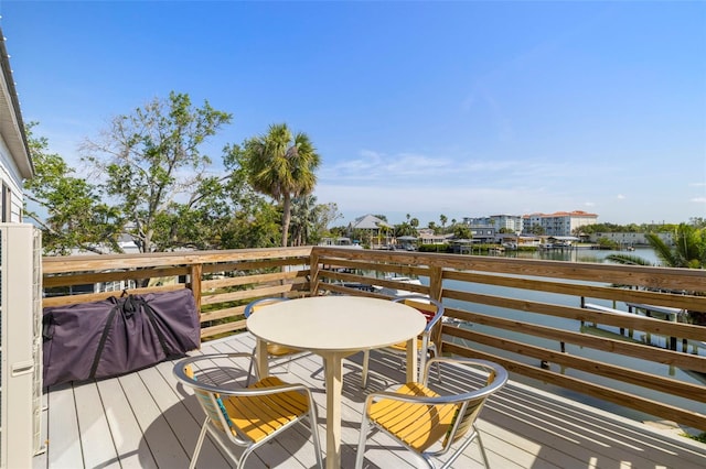 wooden deck featuring a water view
