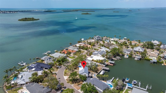 bird's eye view featuring a water view and a residential view