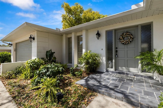 2029 Winding Oaks Dr, Palm Harbor, FL 34683 - property entrance featuring stucco siding and a garage