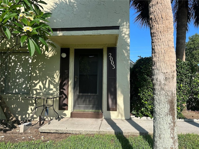 501 E Bay Dr Unit 2003, Largo, FL 33770 - doorway to property featuring stucco siding