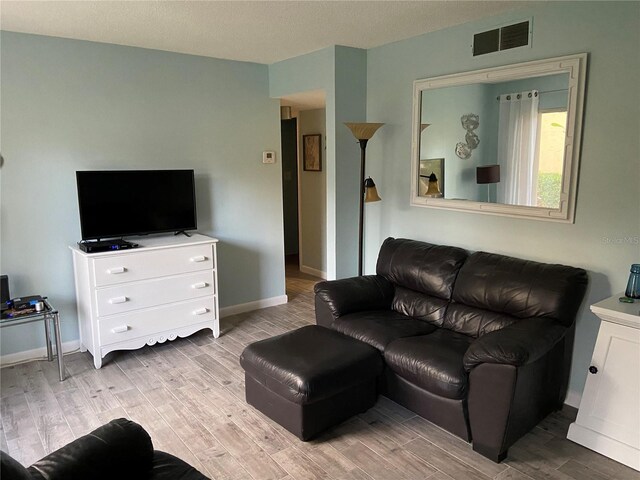 501 E Bay Dr Unit 2003, Largo, FL 33770 - living area featuring light wood-style flooring and baseboards