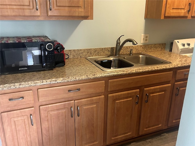 501 E Bay Dr Unit 2003, Largo, FL 33770 - kitchen with black microwave and a sink