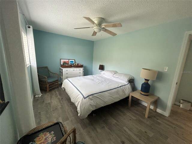 501 E Bay Dr Unit 2003, Largo, FL 33770 - bedroom featuring wood finished floors, a textured ceiling, ceiling fan, and baseboards