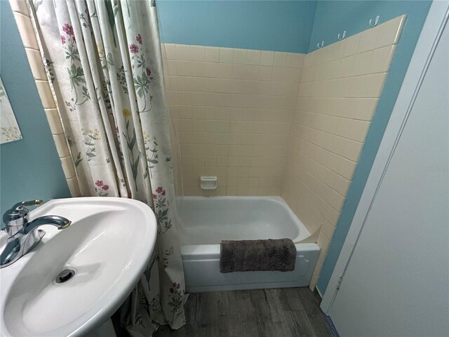 501 E Bay Dr Unit 2003, Largo, FL 33770 - bathroom with a sink, wood finished floors, and shower / bath combo